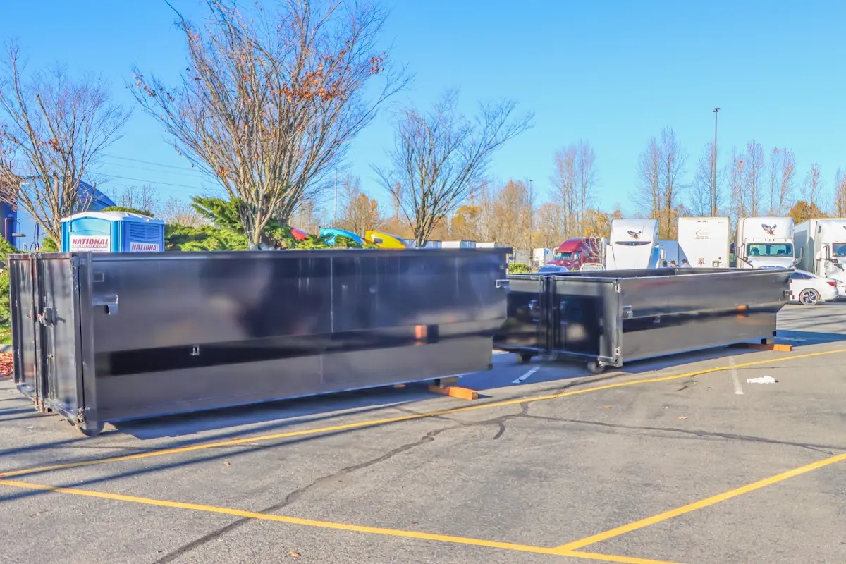 Professional dumpster rental service with roll-off container on residential driveway in Soquel